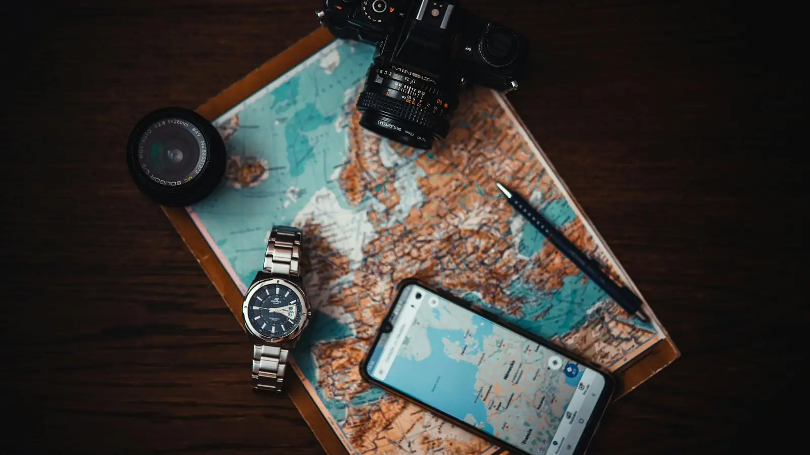 Smartphone showing Pakistan tour planner app on desk