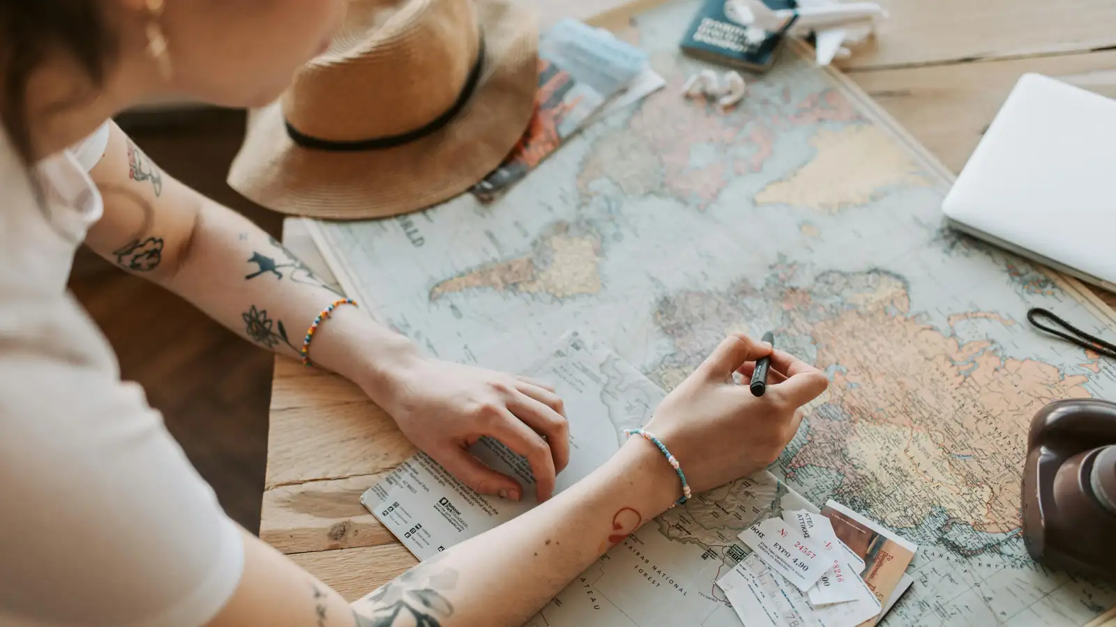 Traveler reviewing a Pakistan trip map and plans