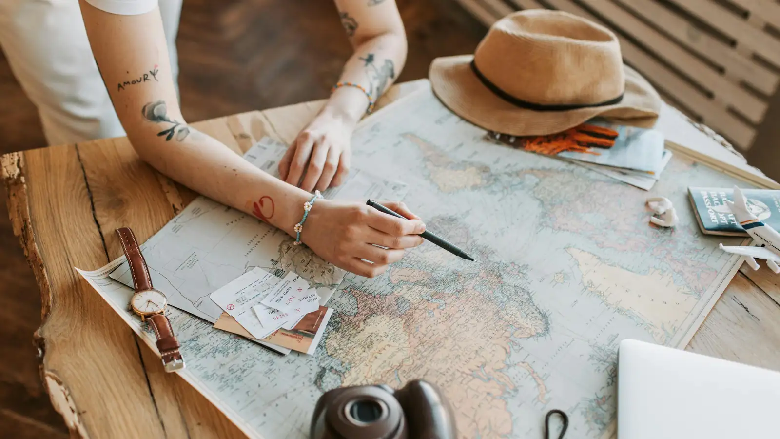 Pakistan travel essentials and printed itinerary on table